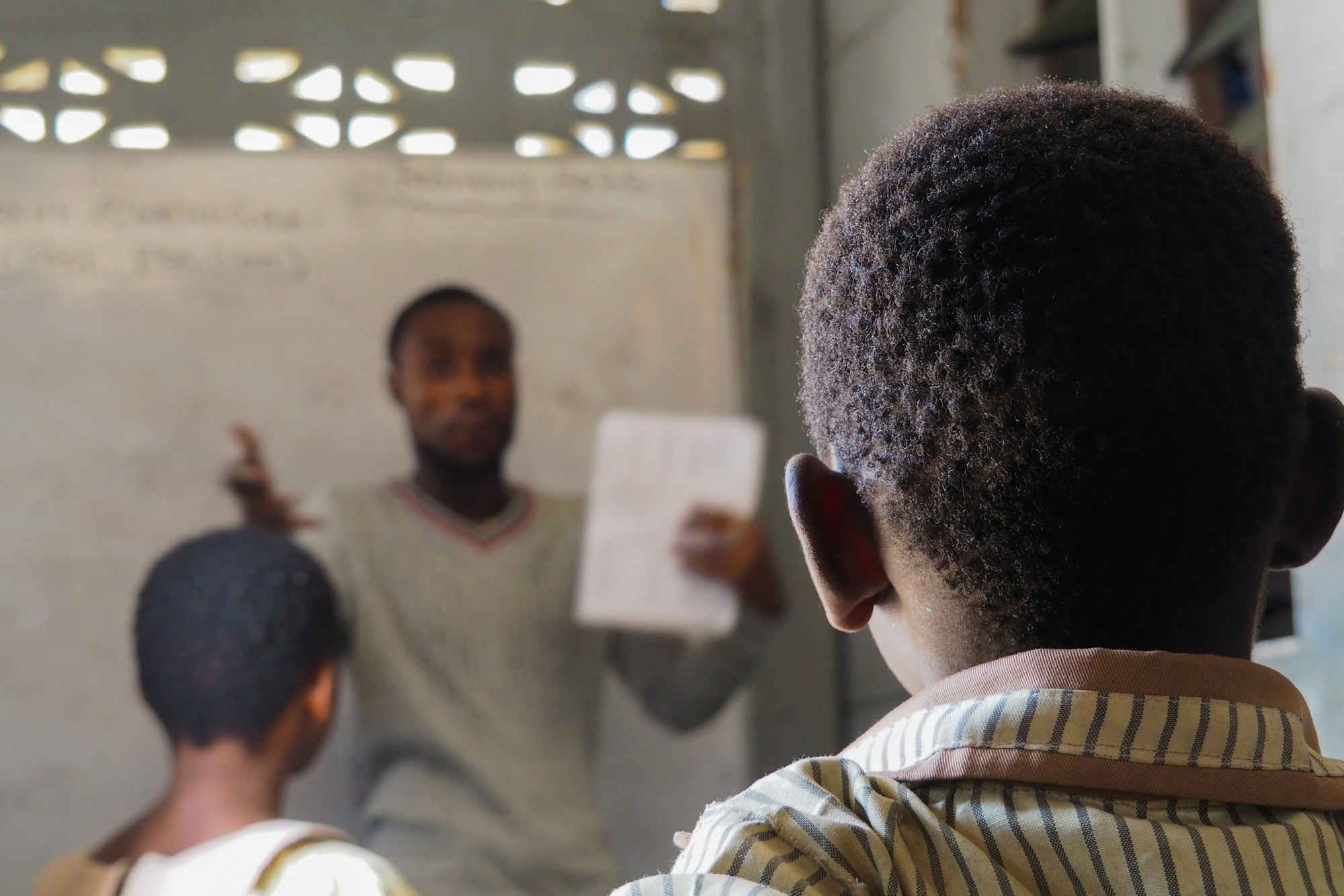 Teacher guiding students in a classroom in Accra, Ghana